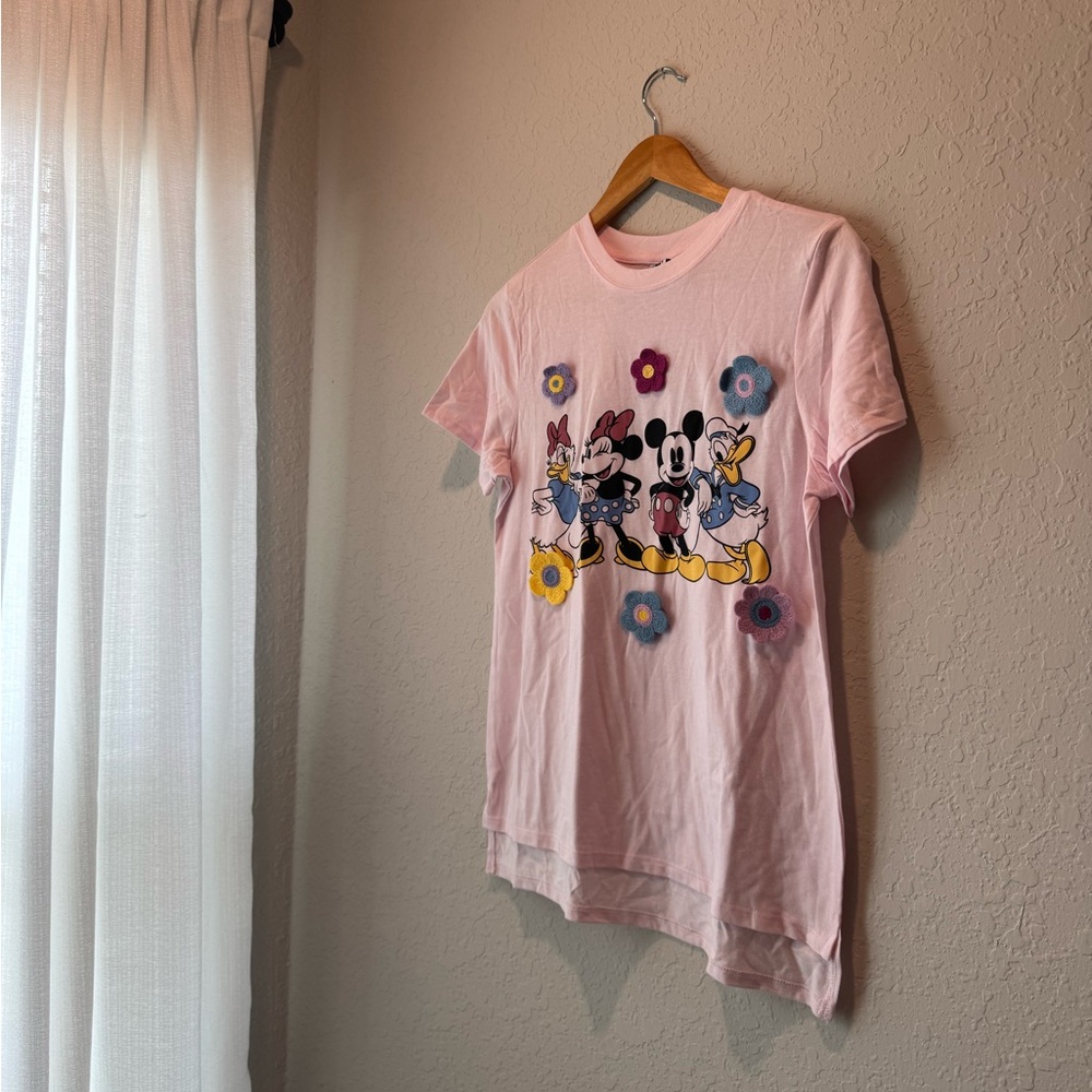 Disney character tee shirt with yarn flowers